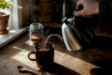 Pouring hot water over freeze-dried coffee granules