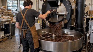 Roaster releasing beans into cooling tray